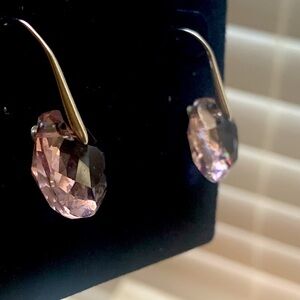 Swarovski earrings used , light purple